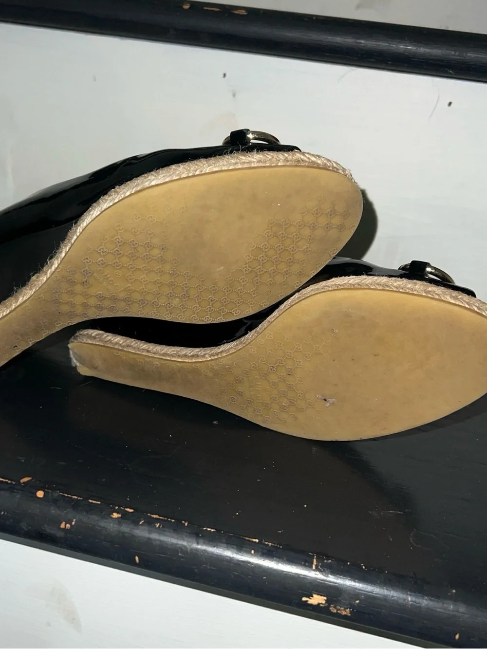 Black patent leather Gucci wedges with horsebit and peep toe
